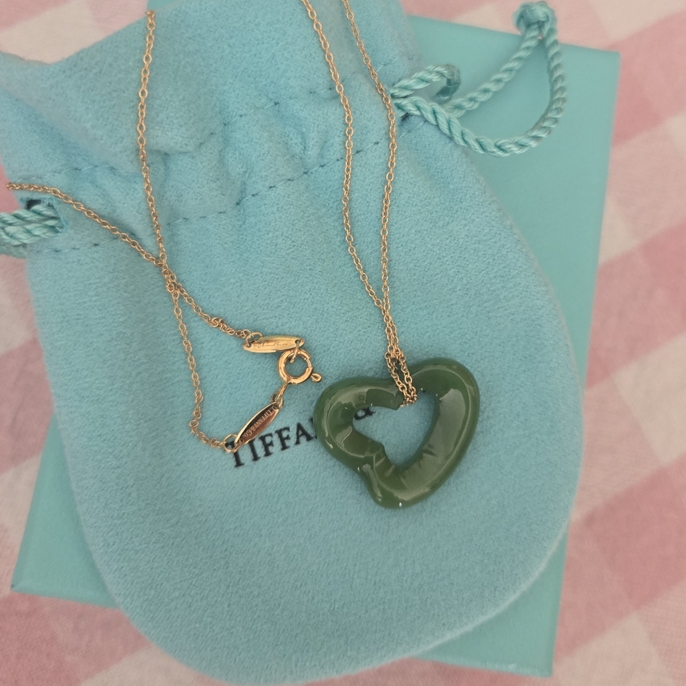 Tiffany & Co. Jade heart, 18 karat gold chain.